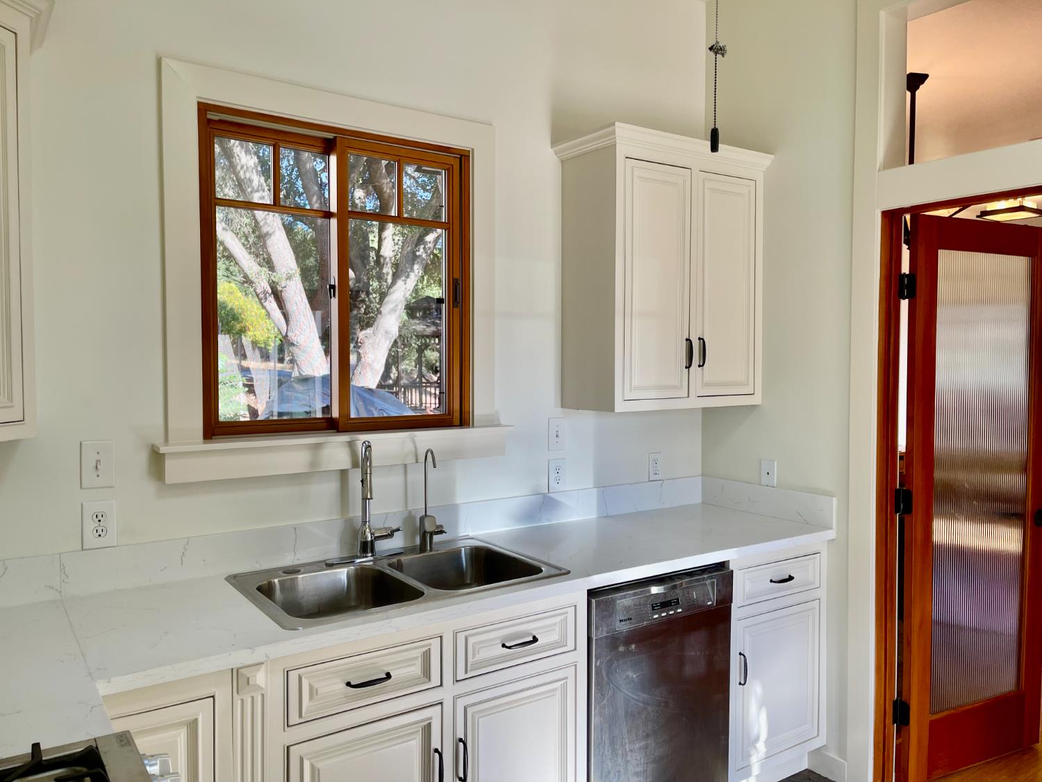 Undisclosed Address Ojai, CA 93023 - Photo 4 of 12 a kitchen with stainless steel appliances white cabinets and a granite counter tops
