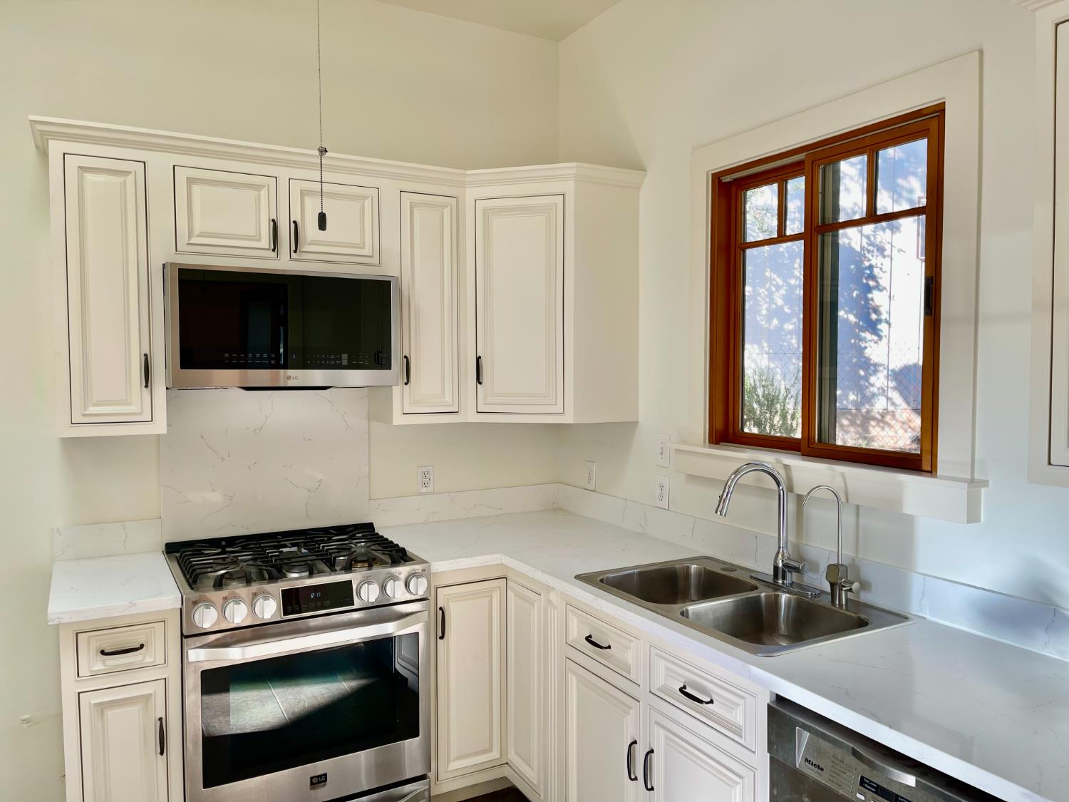 Undisclosed Address Ojai, CA 93023 - Photo 10 of 12 a kitchen with cabinets stainless steel appliances a sink and a window