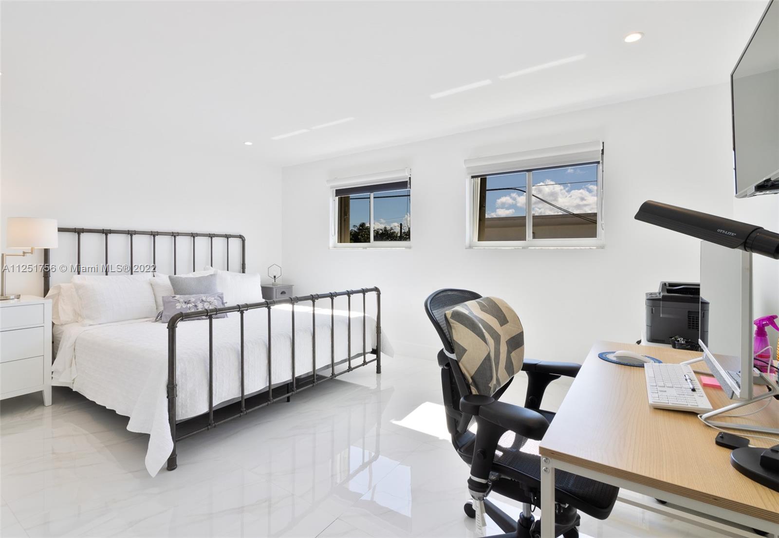 9076 Harding Avenue Surfside, FL 33154 - Photo 21 of 37 a bedroom with furniture and a window