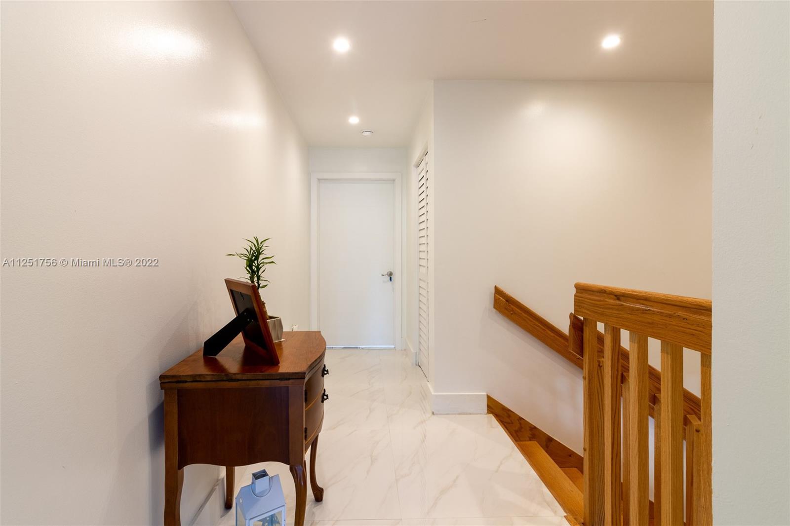 9076 Harding Avenue Surfside, FL 33154 - Photo 25 of 37 a view of hallway with furniture