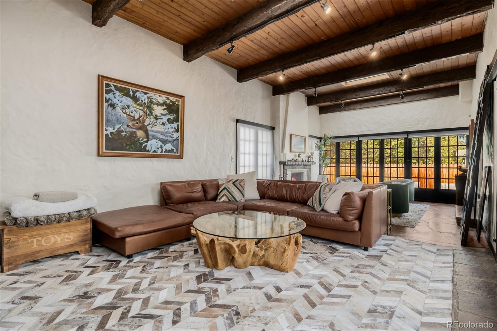 353 Bellaire Street Denver, CO 80220 - Photo 12 of 50 a living room with furniture and a rug