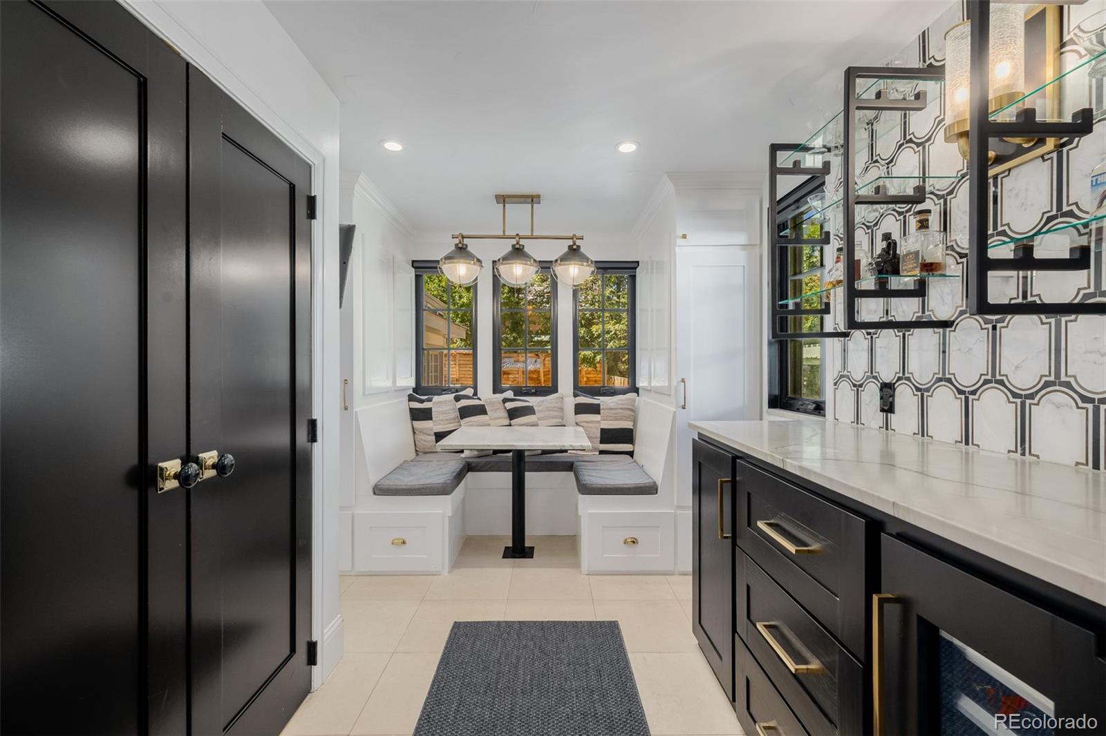 353 Bellaire Street Denver, CO 80220 - Photo 14 of 50 a kitchen with stainless steel appliances granite countertop a sink and cabinets