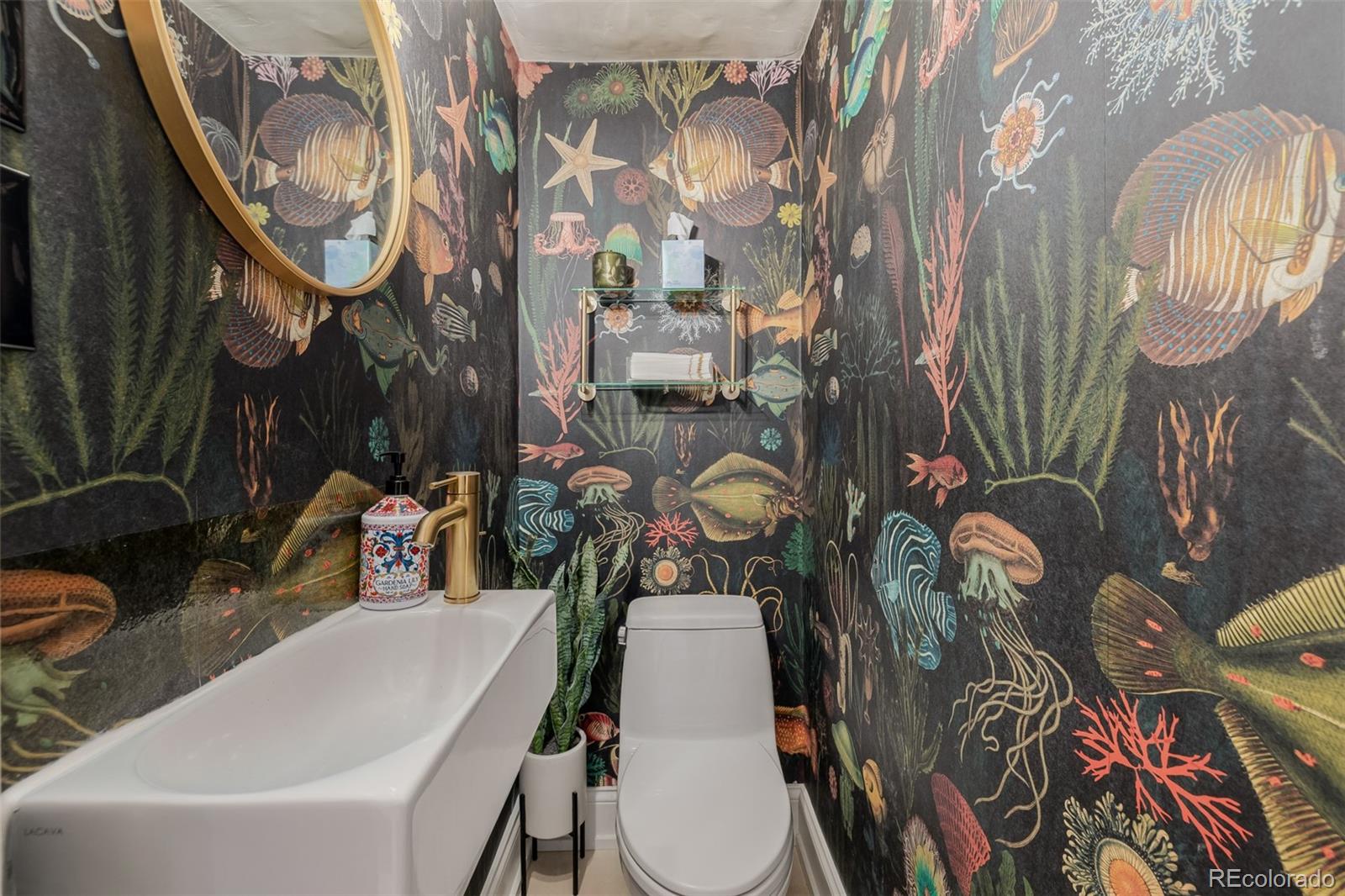 353 Bellaire Street Denver, CO 80220 - Photo 20 of 50 a bathroom with a bathtub and mirror