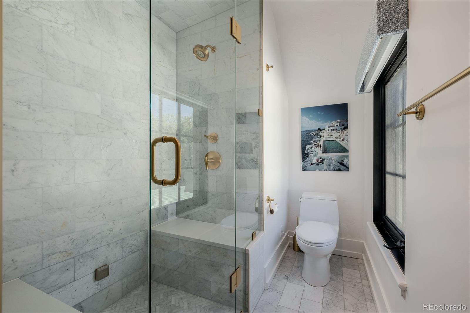 353 Bellaire Street Denver, CO 80220 - Photo 30 of 50 a bathroom with a toilet and a shower