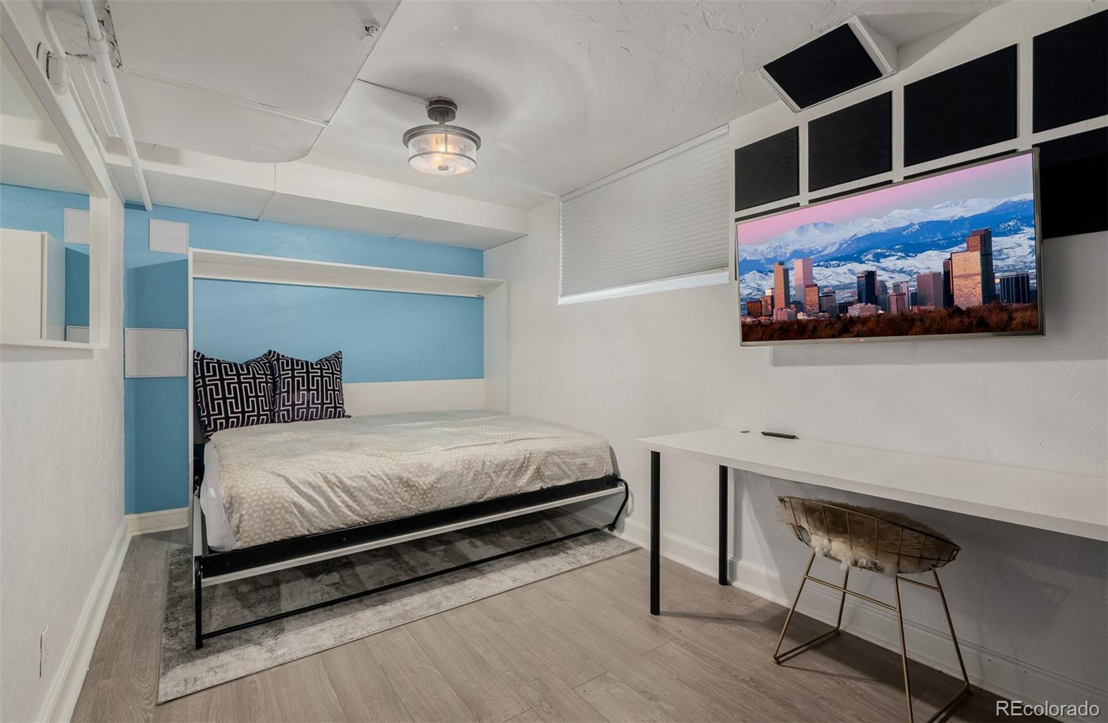 353 Bellaire Street Denver, CO 80220 - Photo 35 of 50 a bedroom with a bed and furniture