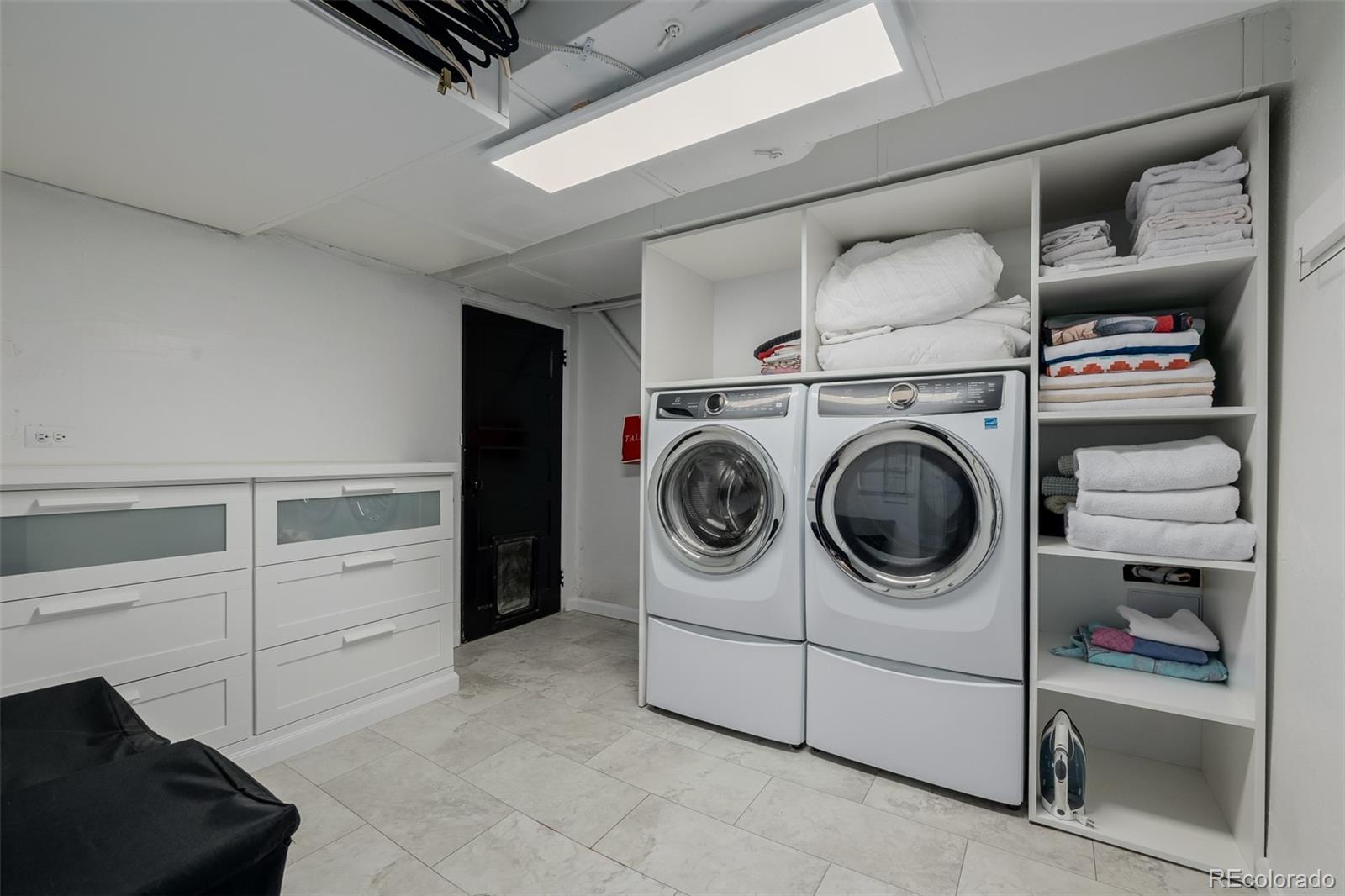353 Bellaire Street Denver, CO 80220 - Photo 38 of 50 a utility room with dryer and washer