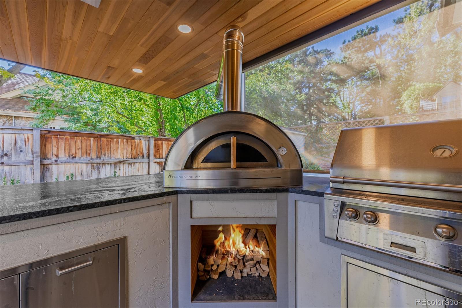 353 Bellaire Street Denver, CO 80220 - Photo 41 of 50 a kitchen with a stove and a sink