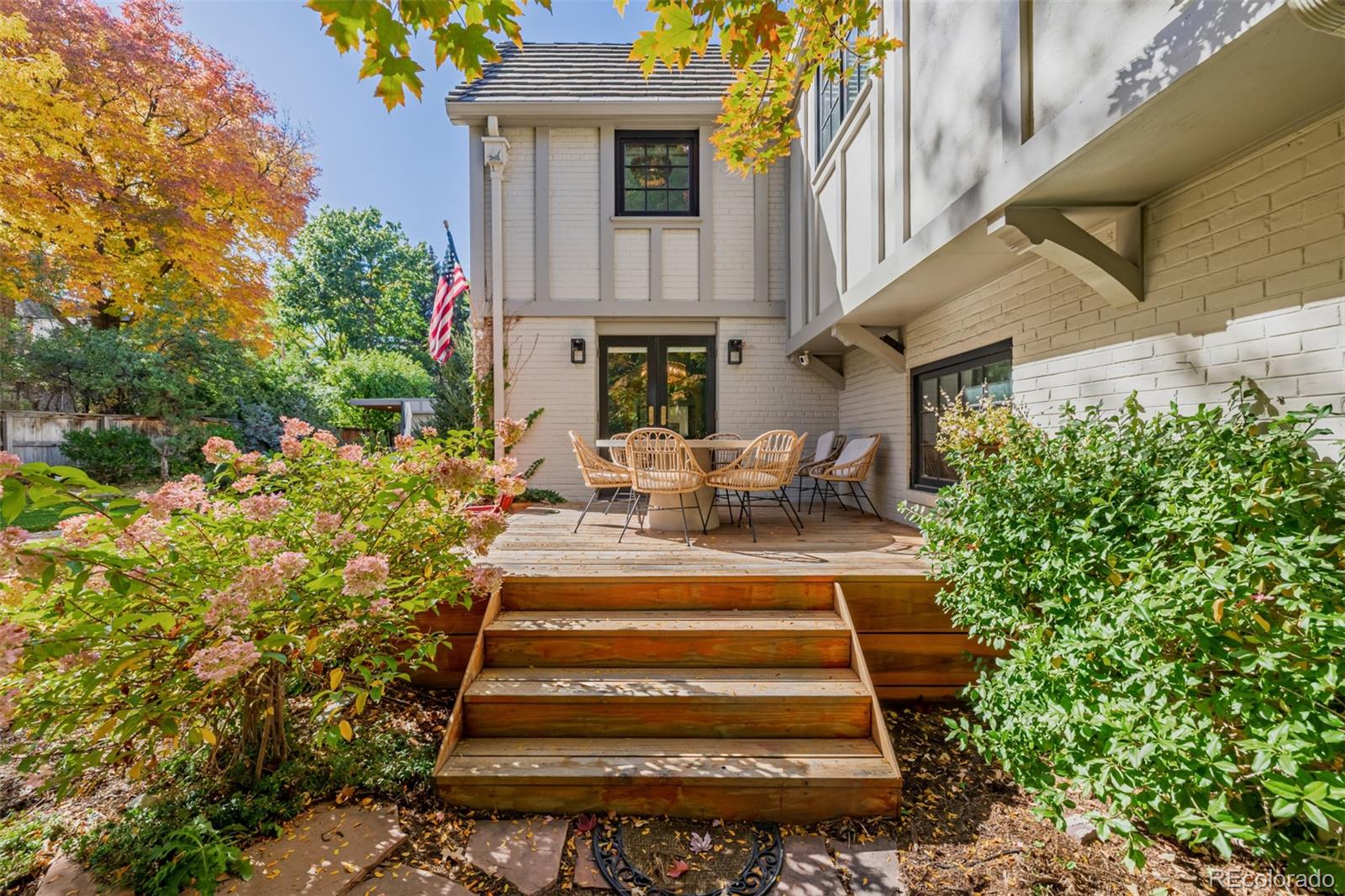353 Bellaire Street Denver, CO 80220 - Photo 46 of 50 a view of a chair and table in the backyard with potted plants