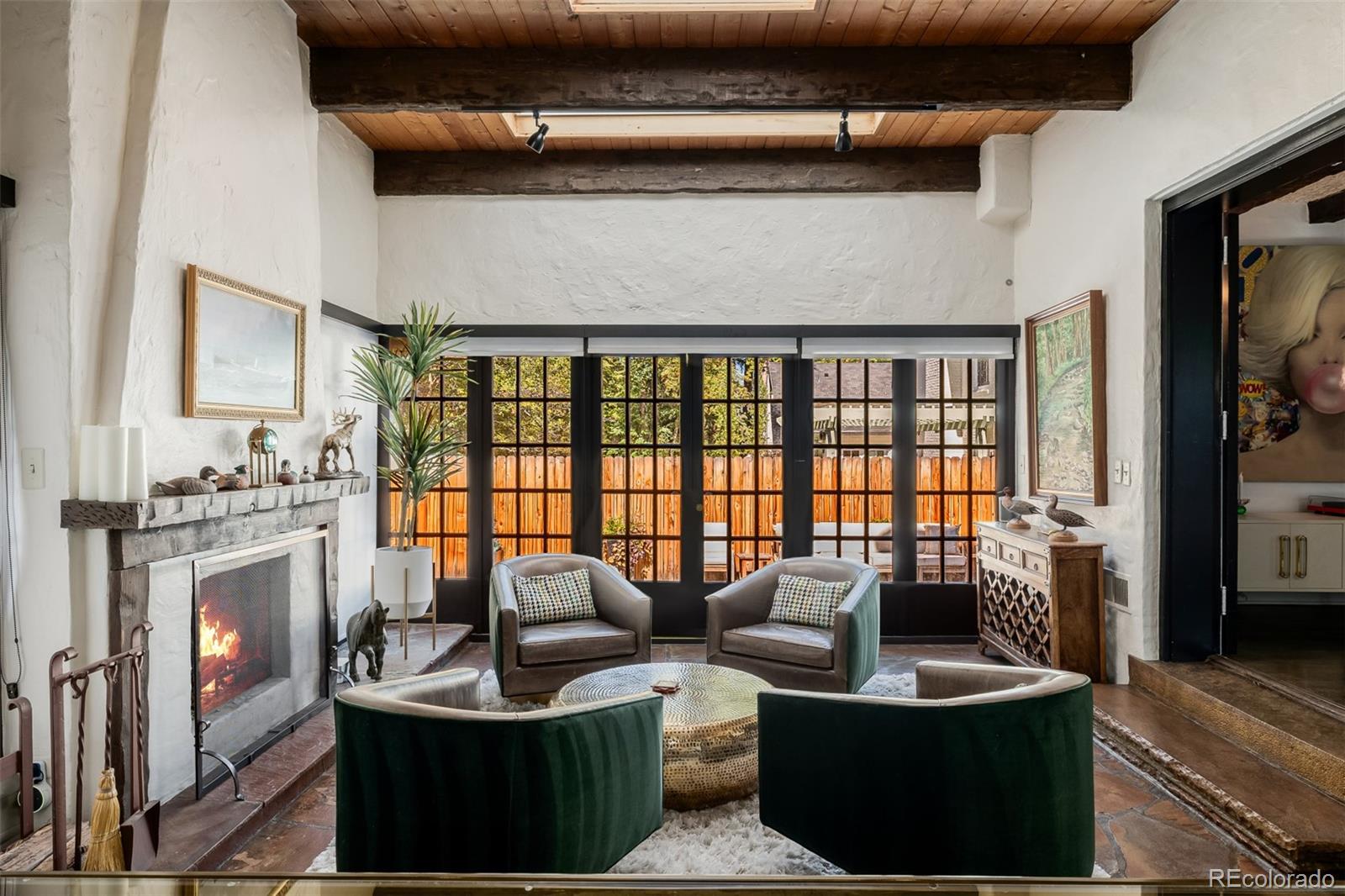 353 Bellaire Street Denver, CO 80220 - Photo 5 of 50 a living room with fireplace furniture and a flat screen tv