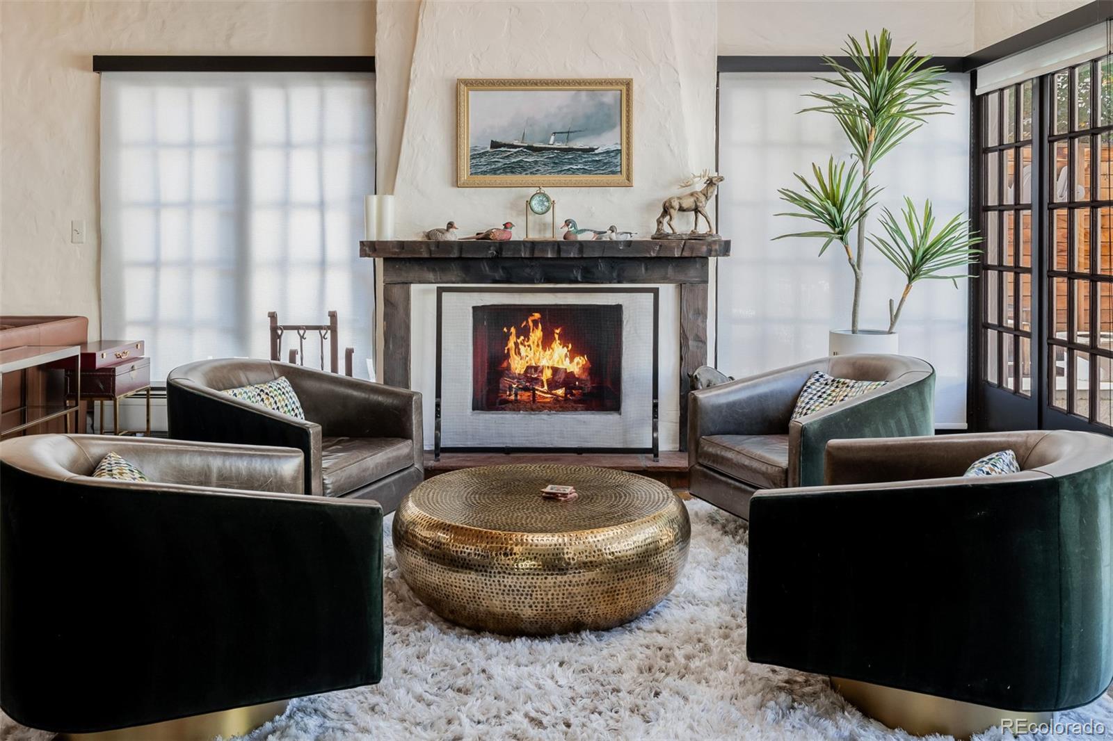 353 Bellaire Street Denver, CO 80220 - Photo 6 of 50 a living room with furniture a fireplace and a potted plant