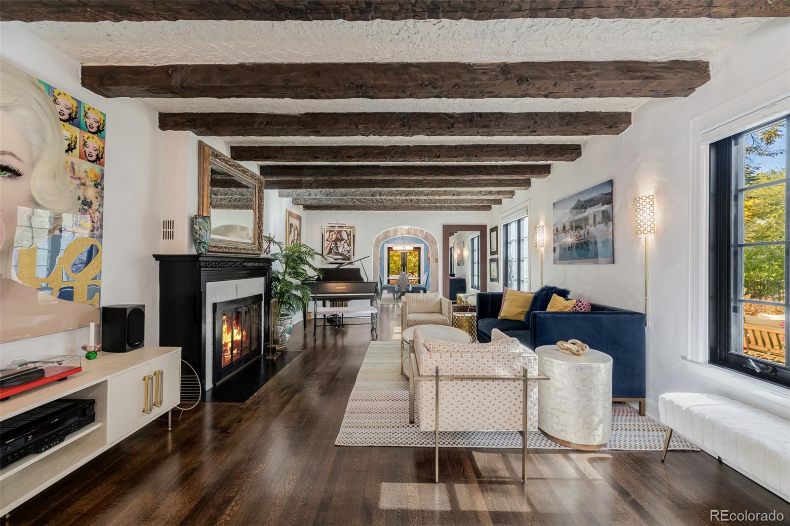 353 Bellaire Street Denver, CO 80220 - Photo 10 of 50 a living room with furniture and a fireplace