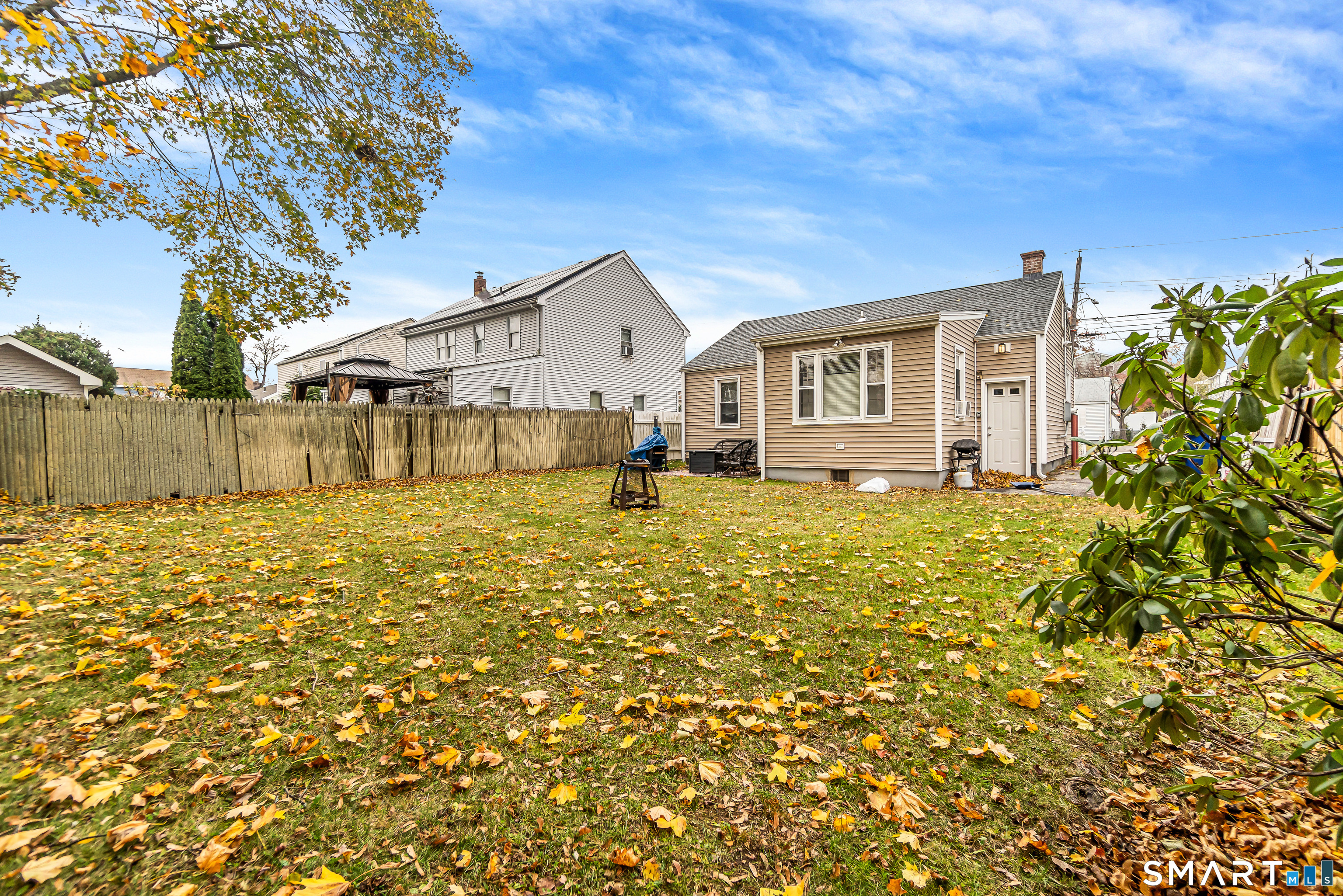 619 Queen Street Bridgeport, CT 06606 - Photo 14 of 16 a front view of a house with a yard