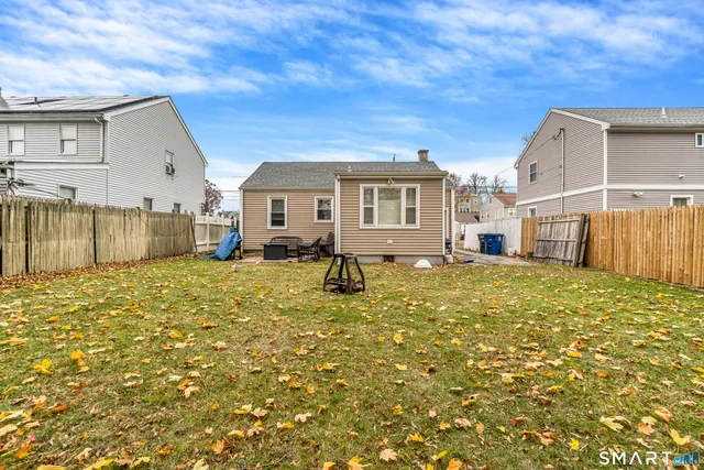 a view of a house with a backyard