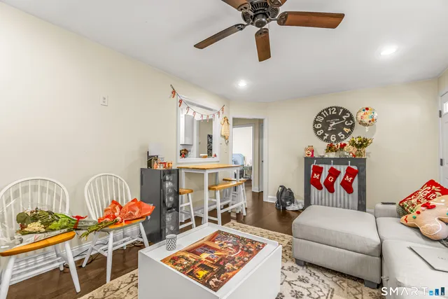 a living room with furniture and a rug