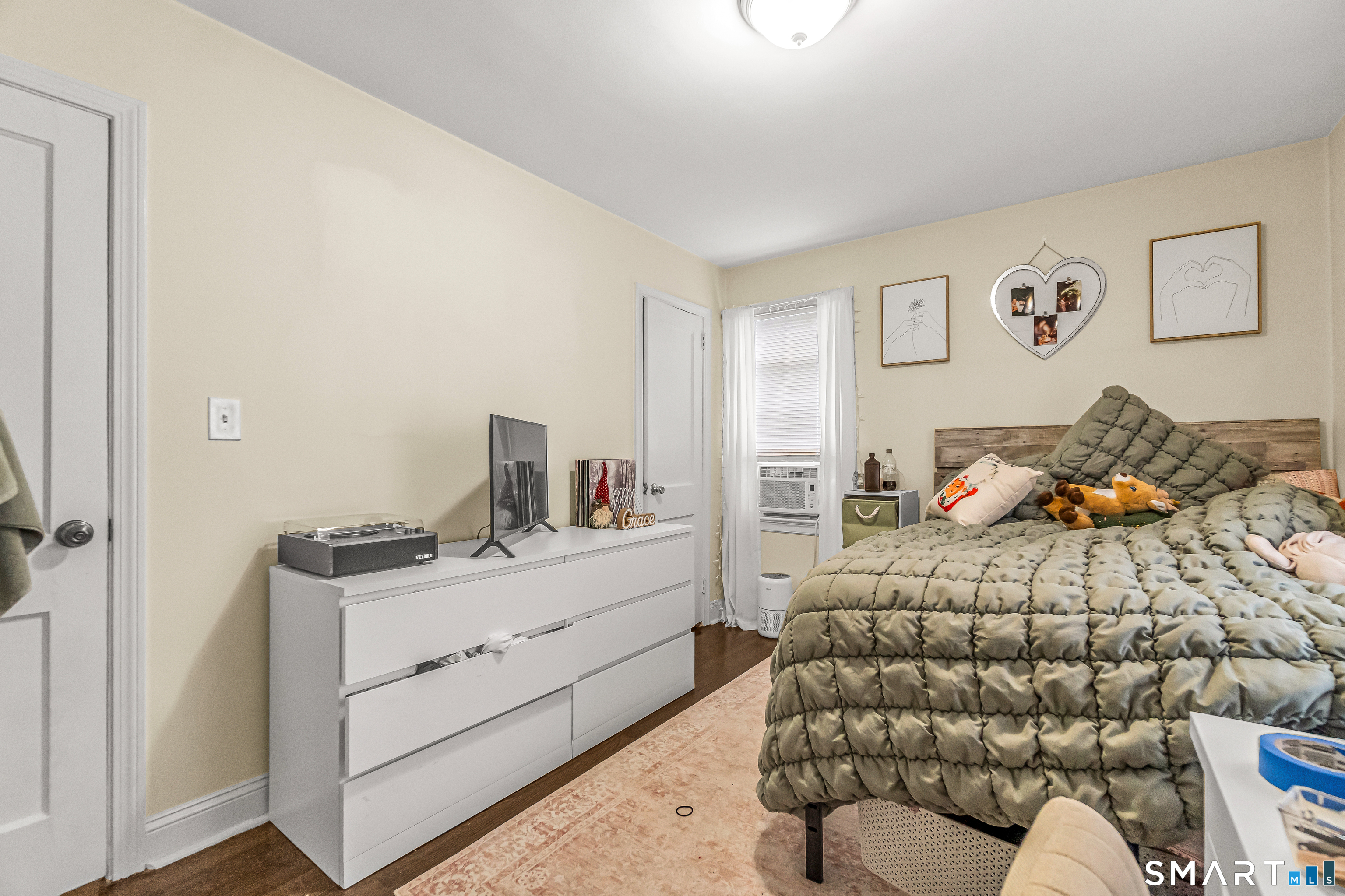 619 Queen Street Bridgeport, CT 06606 - Photo 7 of 16 a bedroom with bed and window