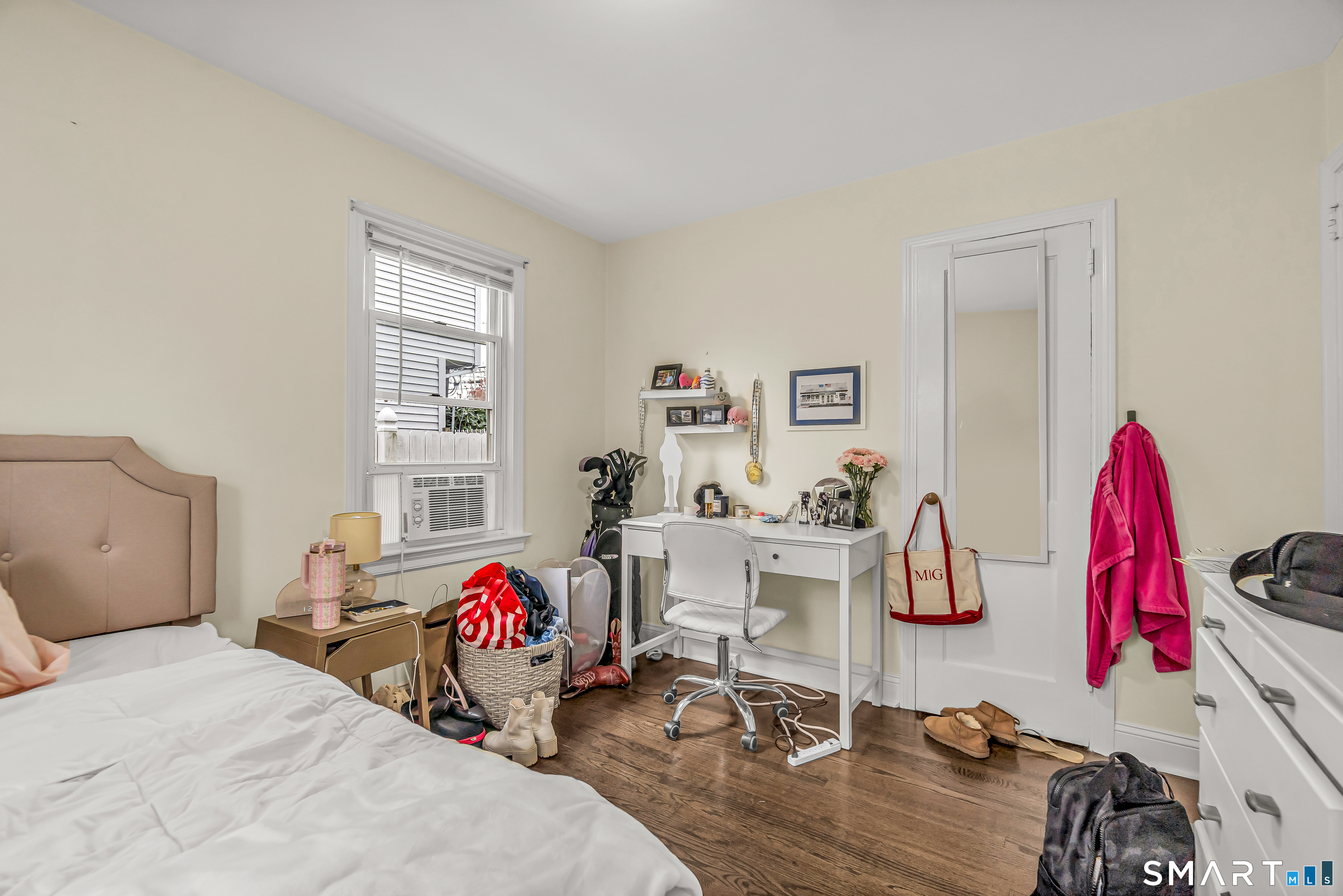 619 Queen Street Bridgeport, CT 06606 - Photo 10 of 16 a bedroom with bed and a large window