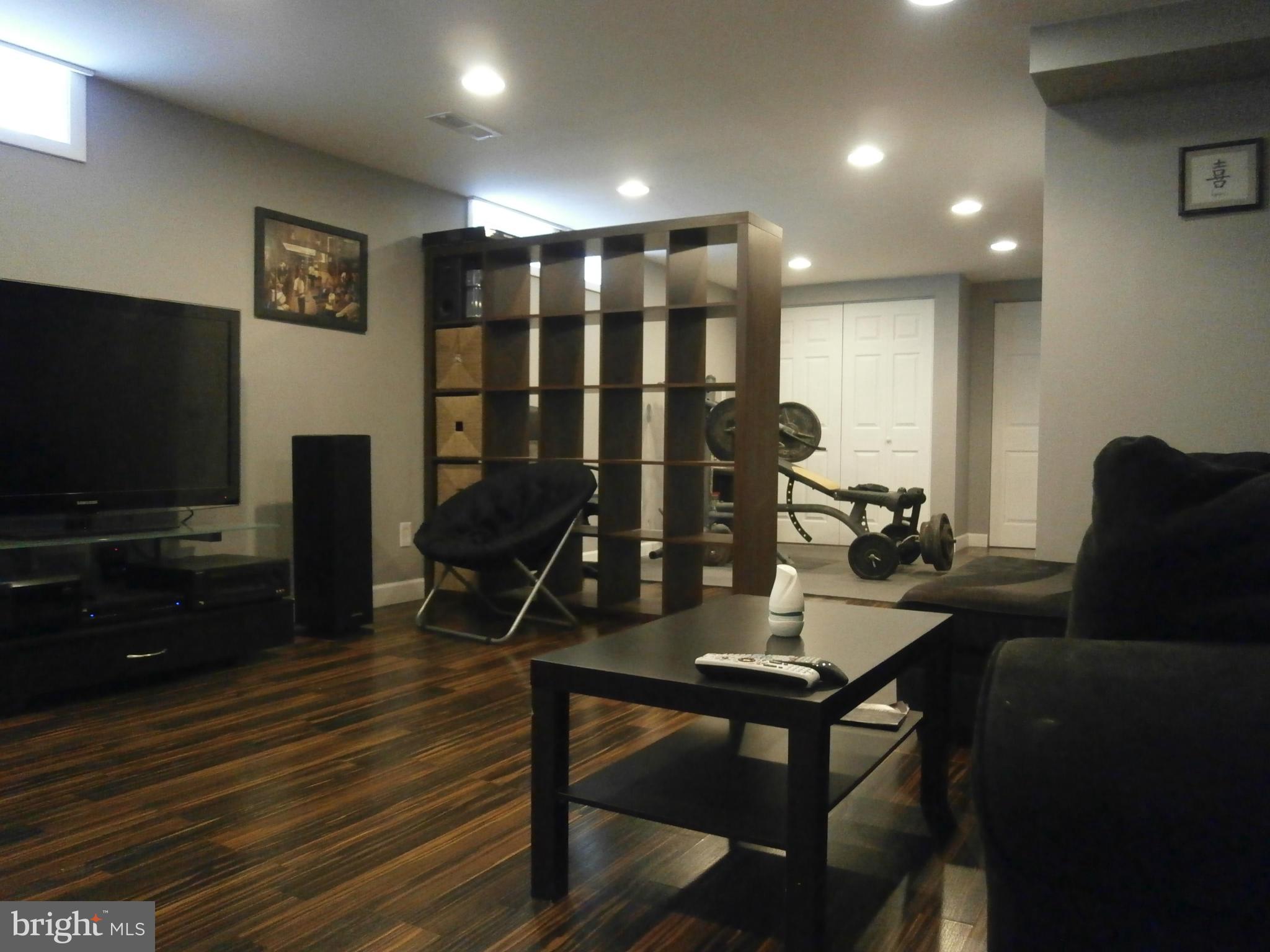 5636 Whitby Road Baltimore, MD 21206 - Photo 12 of 17 a living room with furniture and a flat screen tv