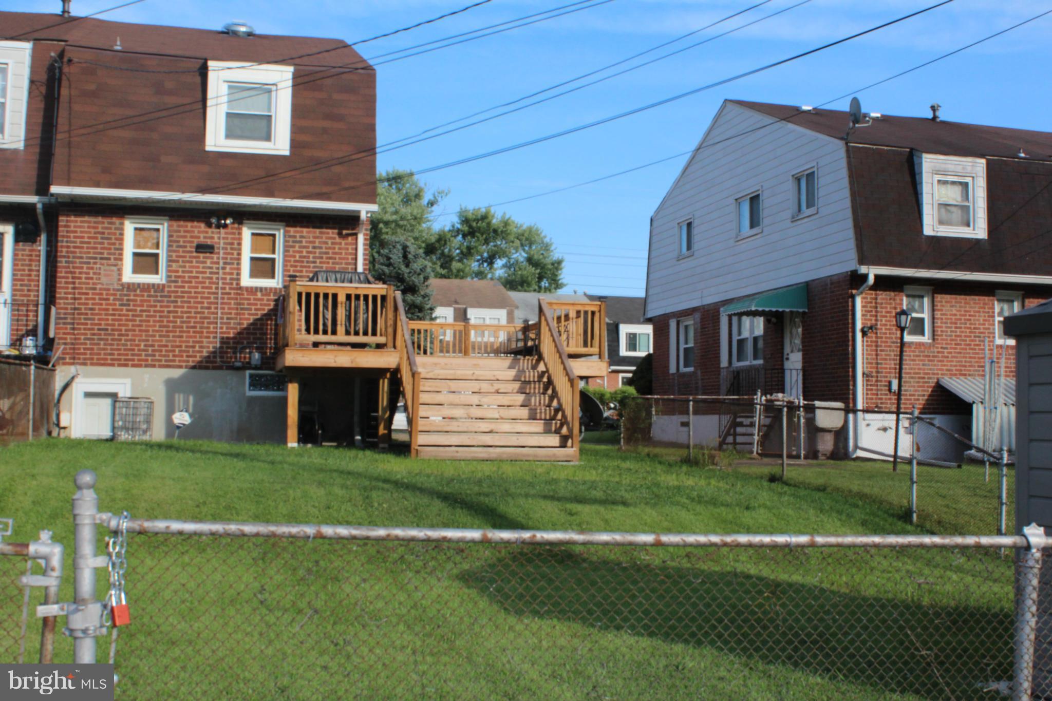 5636 Whitby Road Baltimore, MD 21206 - Photo 16 of 17 a view of a house with a yard deck and a garden