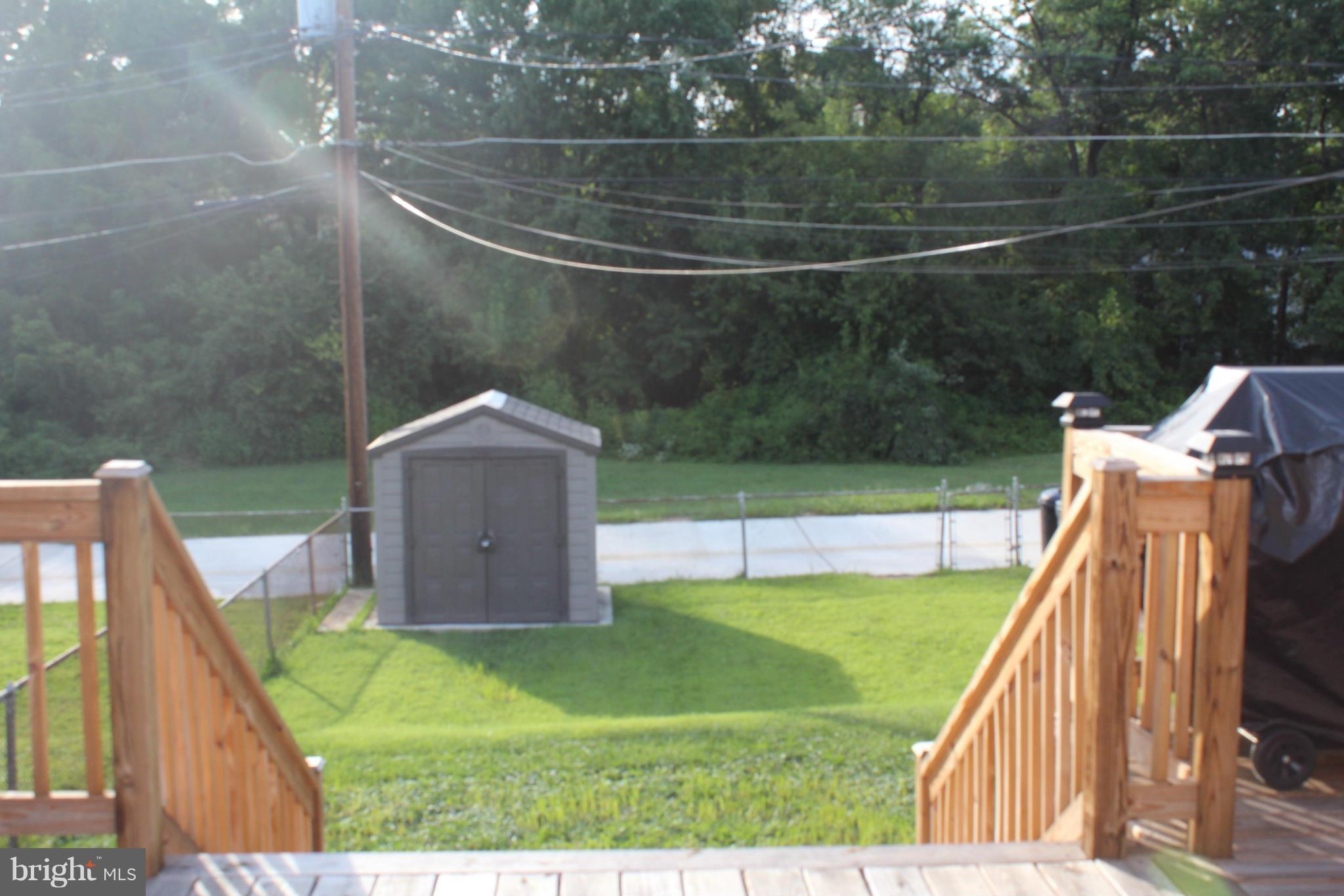 5636 Whitby Road Baltimore, MD 21206 - Photo 17 of 17 a view of a house with a backyard and a tub