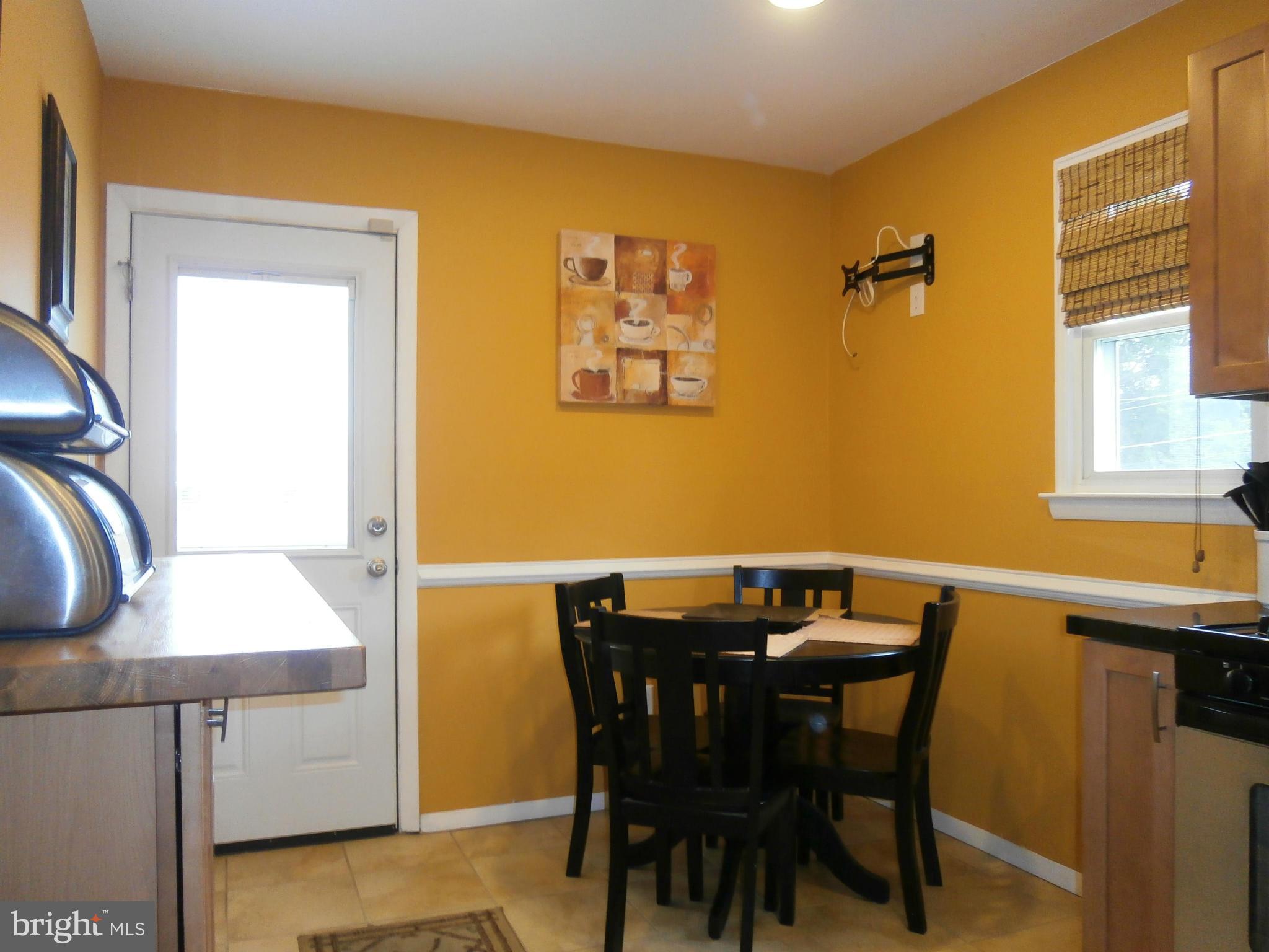 5636 Whitby Road Baltimore, MD 21206 - Photo 5 of 17 a view of a dining room with furniture and window