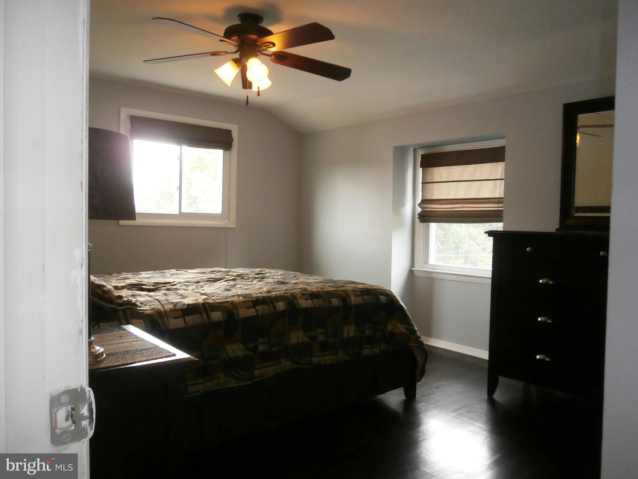5636 Whitby Road Baltimore, MD 21206 - Photo 6 of 17 a bedroom with a bed and a window