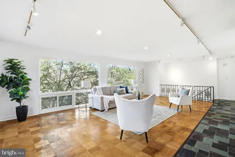 a bedroom with furniture and a fireplace