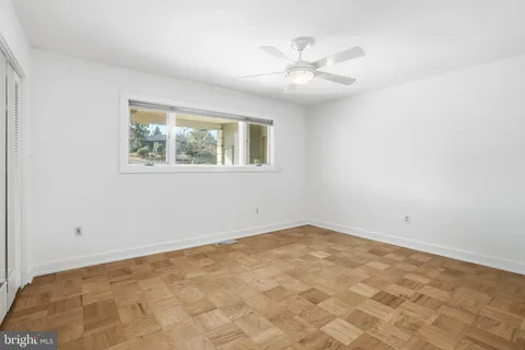 a view of empty room with windows