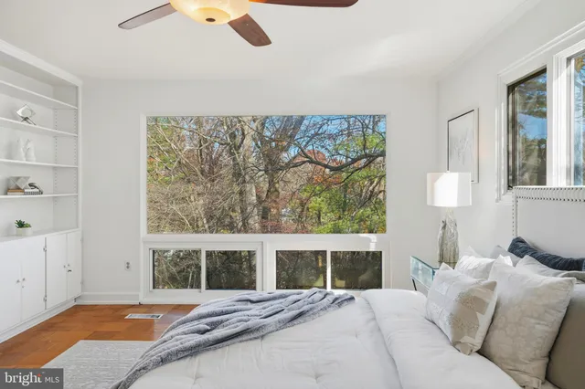 a bedroom with a bed and a cabinets