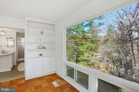 a bathroom with a sink vanity and a mirror