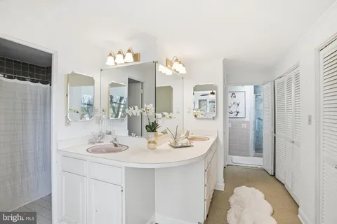 a bathroom with a shower and a window