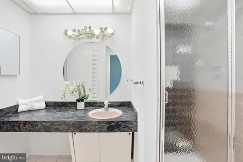 a view of a livingroom with wooden floor and a cabinet