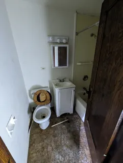 a bathroom with a sink and toilet