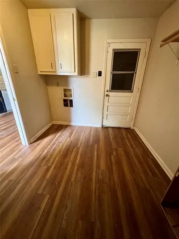 a view of kitchen and wooden floor