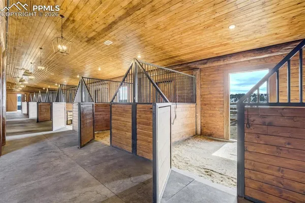 a view of a balcony with wooden floor and stairs