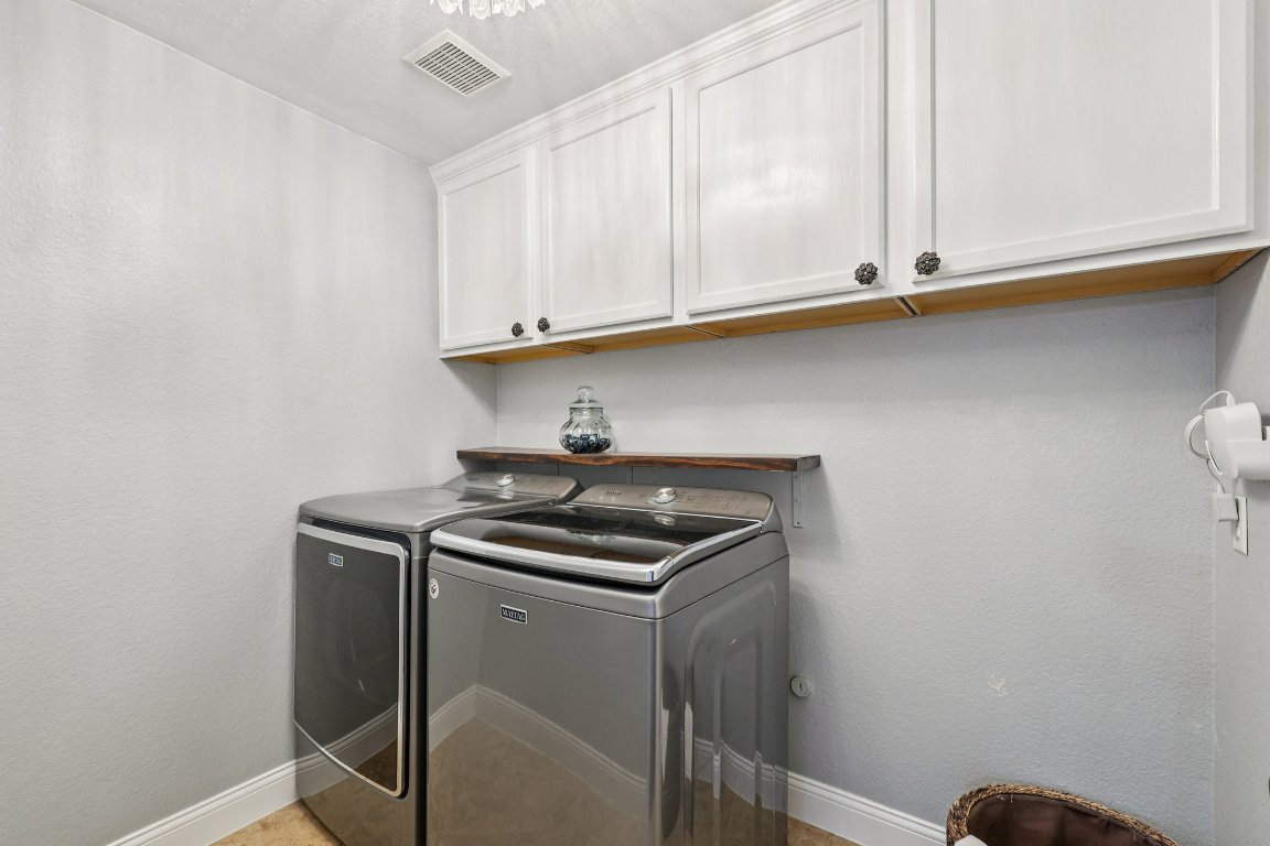 1108 Dalea Bluff Round Rock, TX 78665 - Photo 23 of 40 a utility room with dryer and washer