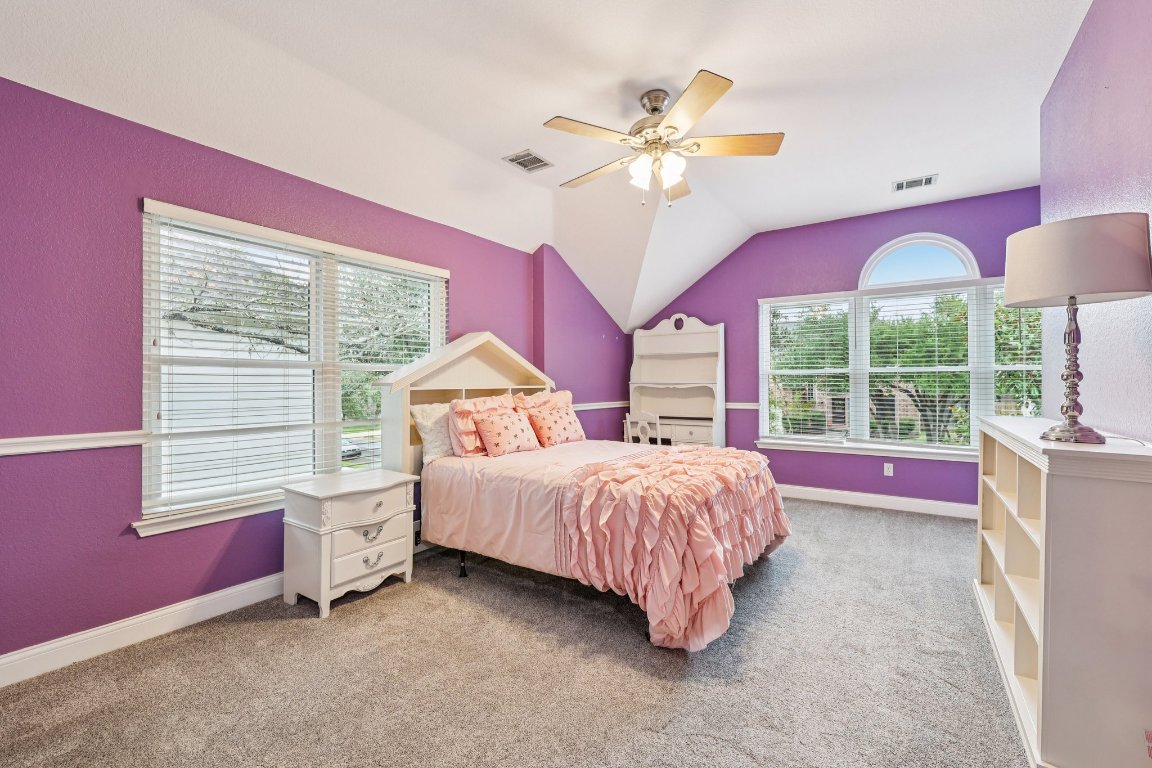 1108 Dalea Bluff Round Rock, TX 78665 - Photo 26 of 40 a bedroom with a bed chandelier and a window