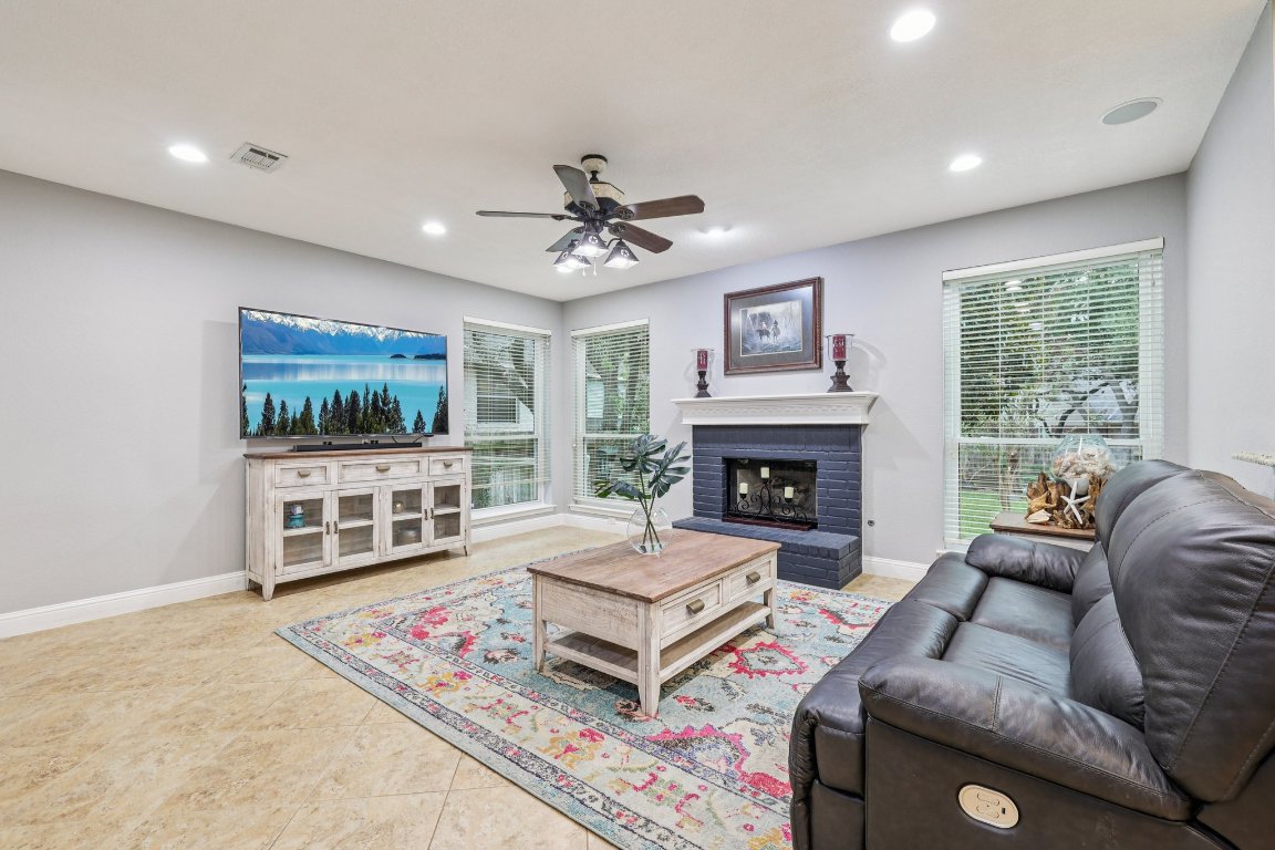 1108 Dalea Bluff Round Rock, TX 78665 - Photo 5 of 40 a living room with furniture and a fireplace