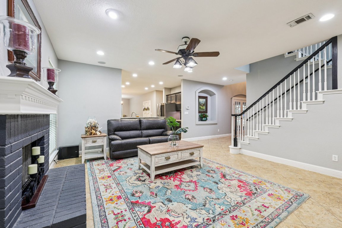 1108 Dalea Bluff Round Rock, TX 78665 - Photo 6 of 40 a living room with furniture and a fireplace