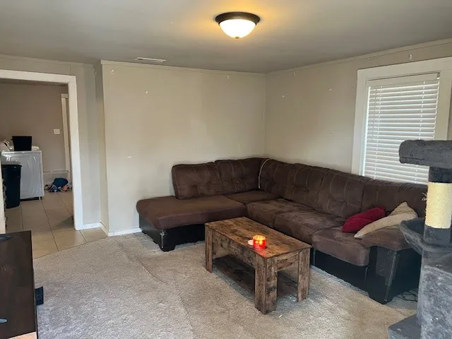 a living room with furniture and a couch