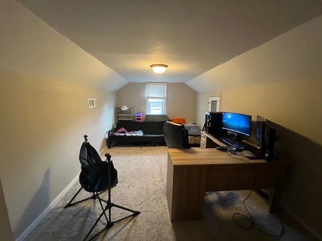 a room with furniture and a flat screen tv