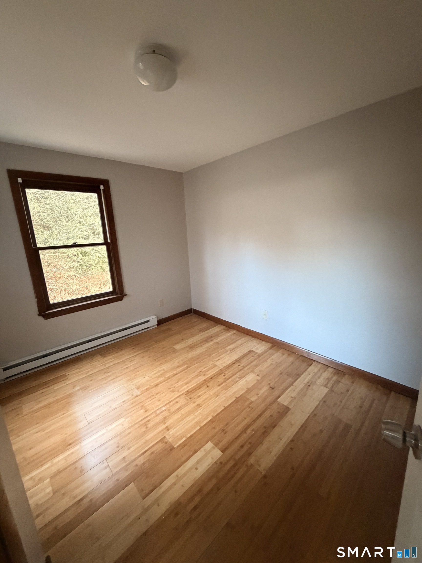 844 Field Street Naugatuck, CT 06770 - Photo 4 of 6 an empty room with windows