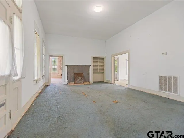 an empty room with windows