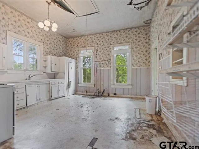 a bathroom with a sink a mirror and a shower