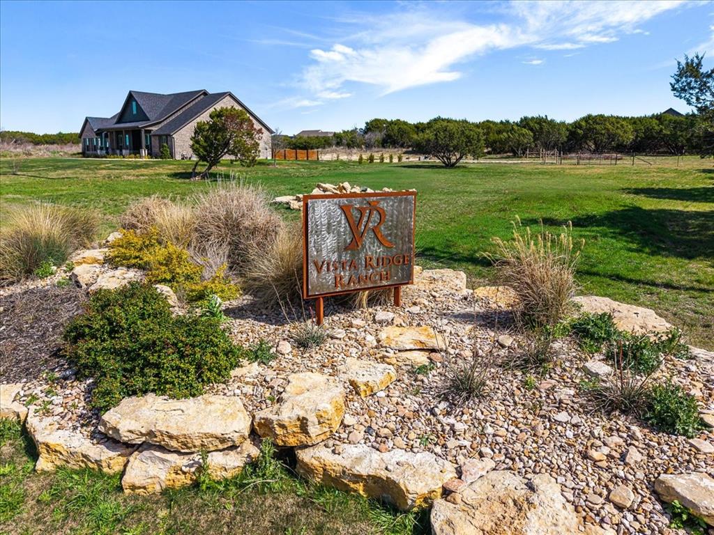 1081 County Road Nemo, TX 76070 - Photo 3 of 19 a view of a lake with a house in the background