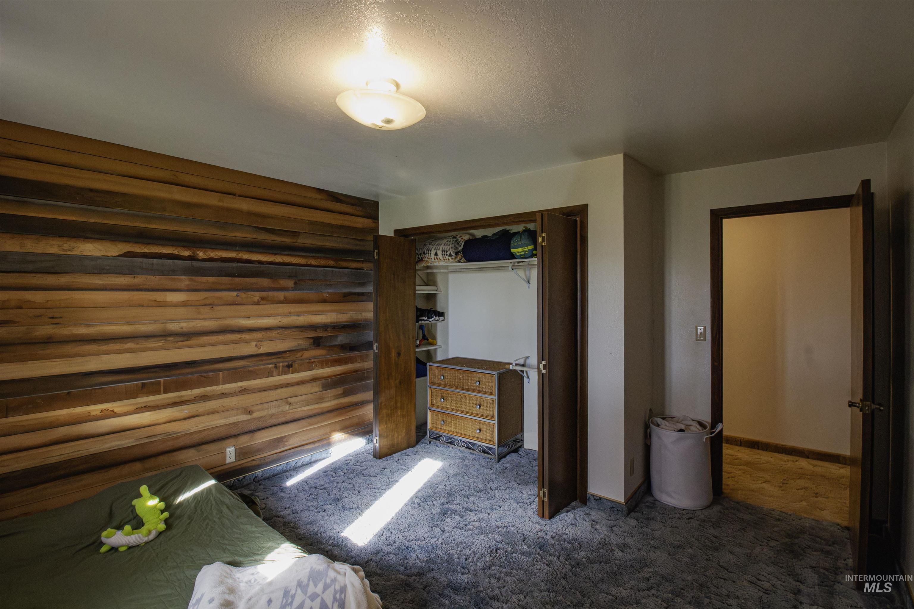 887 Overstreet Road Nyssa, OR 97913 - Photo 28 of 50 Bedroom featuring a closet and carpet flooring