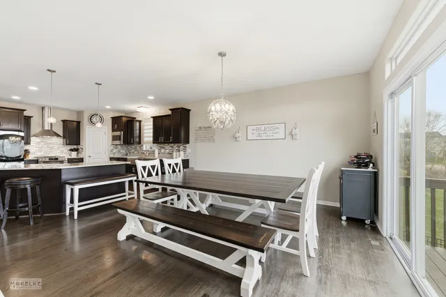 a view of kitchen with sink microwave and stove