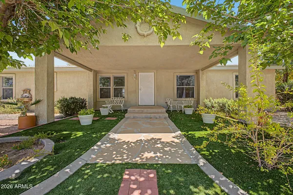 a front view of a house with garden