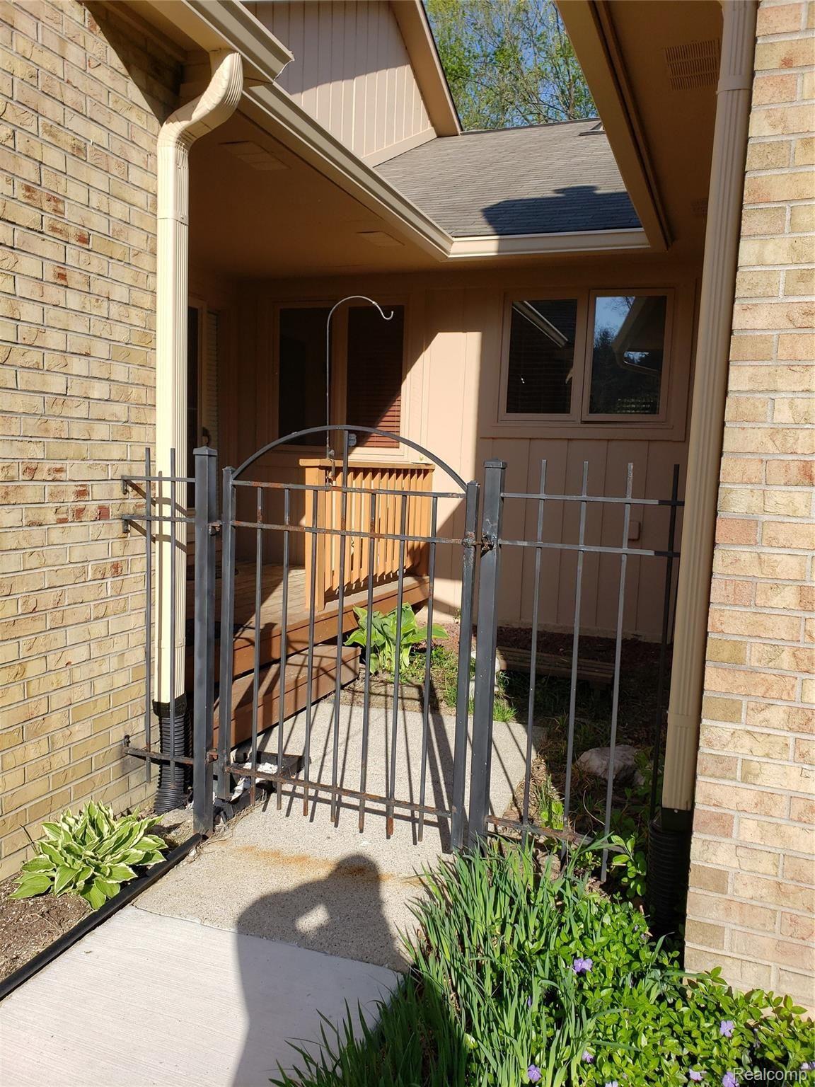 21970 River Ridge Trail, Unit 72 Farmington, MI 48335 - Photo 2 of 38 Main Entrance Gate & Deck