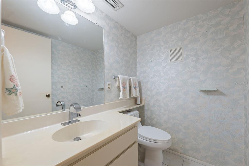 2192 Swedish Drive, Unit 26 Clearwater, FL 33763 - Photo 22 of 49 a bathroom with a sink a toilet and mirror