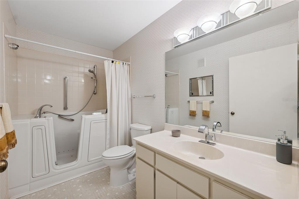 2192 Swedish Drive, Unit 26 Clearwater, FL 33763 - Photo 27 of 49 a bathroom with a toilet sink and mirror